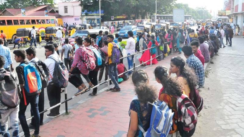 Passengers wait for the bus in front of Thampanoor central bus stand in Thiruvananthapuram on Monday. (Photo: DC) Passengers wait for the bus in front of Thampanoor central bus stand in Thiruvananthapuram on Monday. (Photo: DC)