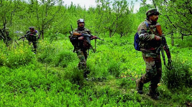 Army personnel during an anti-militancy operation aimed at targeting militants who have been hiding and striking against security forces, in South Kashmir’s Shopian district. (Photo: PTI) Army personnel during an anti-militancy operation aimed at targeting militants who have been hiding and striking against security forces, in South Kashmir’s Shopian district. (Photo: PTI)