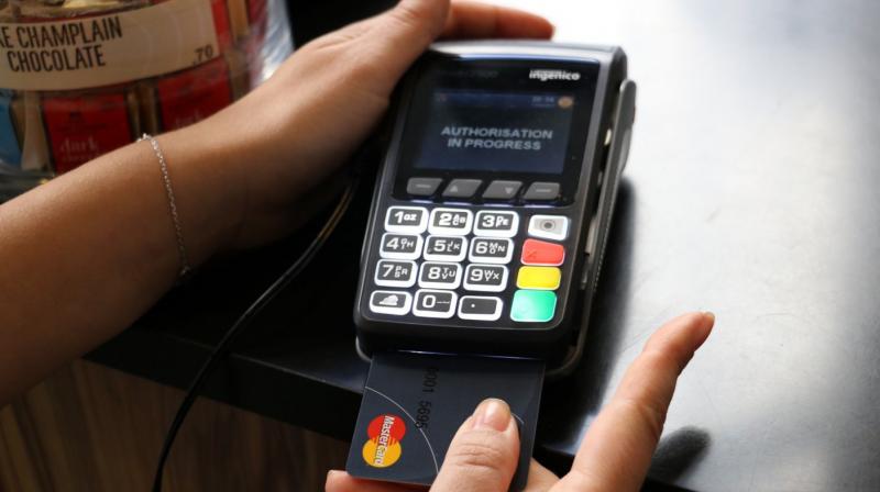 All you need to do is place your authorised finger on the sensor patch of the card while the payment terminal/machine asks for your confirmation for the transaction that you are undertaking. (image: engadget) All you need to do is place your authorised finger on the sensor patch of the card while the payment terminal/machine asks for your confirmation for the transaction that you are undertaking. (image: engadget)