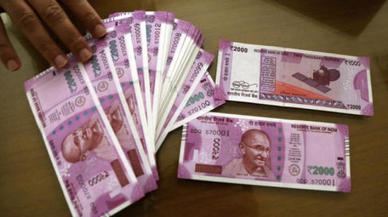 New notes of Rs 2000 issued by the Reserve Bank of India. (Photo: PTI) New notes of Rs 2000 issued by the Reserve Bank of India. (Photo: PTI)