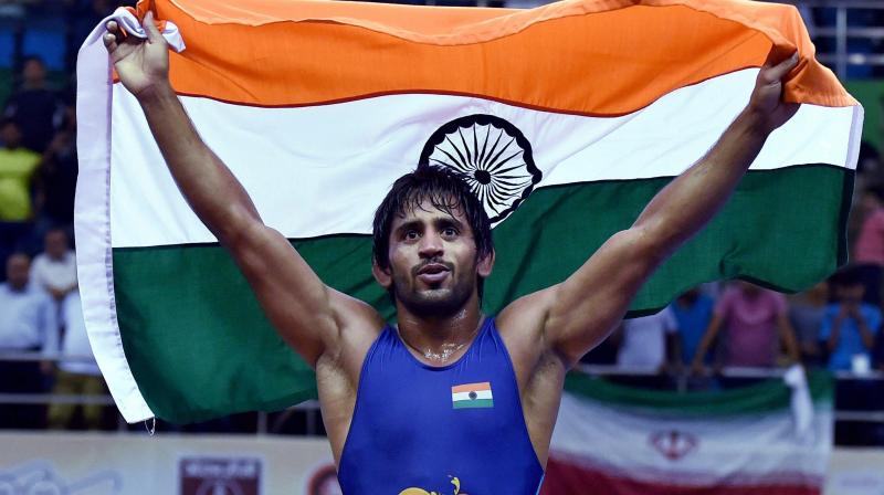 The Kazakh grappler made a fiery start to put Punia under pressure but the Indian was able to turn it around late in the second period to clinch a thrilling 12-7 win. (Photo: PTI) The Kazakh grappler made a fiery start to put Punia under pressure but the Indian was able to turn it around late in the second period to clinch a thrilling 12-7 win. (Photo: PTI)