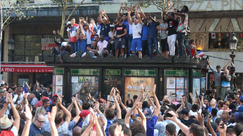 The World Cup-winning French team parade was under heavy police guard, with some of the 2,000 officers deployed in the capital to ensure the safety of the estimated 300,000 people who turned up. (Photo: ) The World Cup-winning French team parade was under heavy police guard, with some of the 2,000 officers deployed in the capital to ensure the safety of the estimated 300,000 people who turned up. (Photo: )
