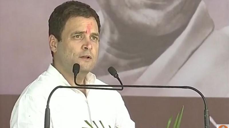 Congress Vice-President Rahul Gandhi addressing a rally at Debiapada, in Gujarat on Monday. (Photo: ANI/Twitter) Congress Vice-President Rahul Gandhi addressing a rally at Debiapada, in Gujarat on Monday. (Photo: ANI/Twitter)
