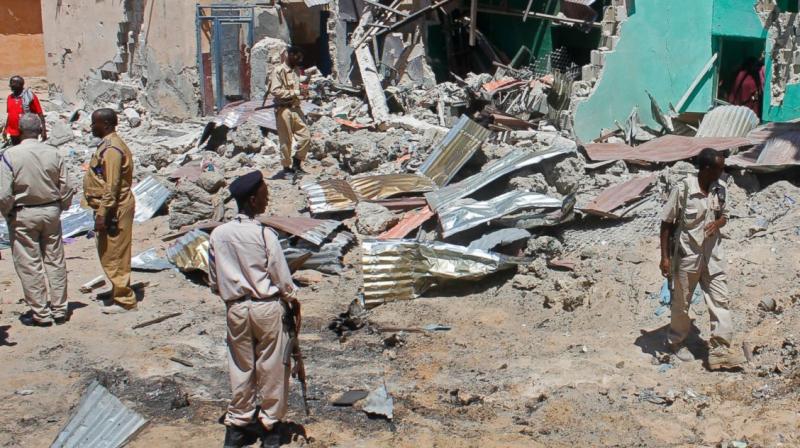 Somali soldiers look at the destroyed houses amidst the wreckage of a car bomb blast in Mogadishu, Somalia. (Photo: AP) Somali soldiers look at the destroyed houses amidst the wreckage of a car bomb blast in Mogadishu, Somalia. (Photo: AP)