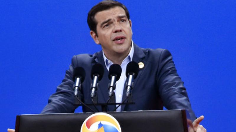 Prime Minister Alexis Tsipras is seeking parliamentary approval for the pension cuts and further tax hikes through 2020, as part of an agreement with international bailout creditors to release the next bailout installment. (Photo: AP) Prime Minister Alexis Tsipras is seeking parliamentary approval for the pension cuts and further tax hikes through 2020, as part of an agreement with international bailout creditors to release the next bailout installment. (Photo: AP)
