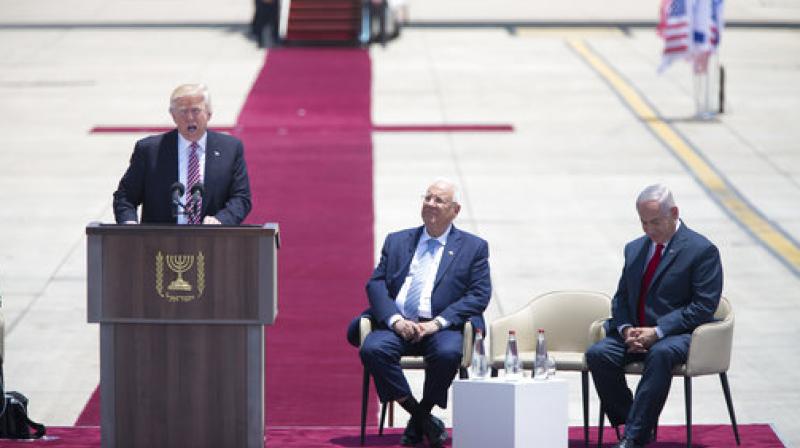 US President Donald Trump speaks during welcome ceremony in Tel Aviv, accompanied by Israel's President Reuven Rivlin, center, and Prime Minister Benjamin Netanyahu US President Donald Trump speaks during welcome ceremony in Tel Aviv, accompanied by Israel's President Reuven Rivlin, center, and Prime Minister Benjamin Netanyahu