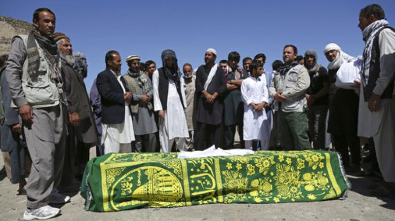 Afghans pray during the funeral of a victim who died in Wednesday's massive bombing, in Kabul, Afghanistan.(Photo: AP) Afghans pray during the funeral of a victim who died in Wednesday's massive bombing, in Kabul, Afghanistan.(Photo: AP)