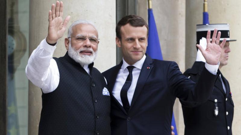 French President Emmanuel Macron, left, welcomes Indian Prime Minister Narendra Modi, before their meeting at the Elysee Palace in Paris, France. (Photo: AP) French President Emmanuel Macron, left, welcomes Indian Prime Minister Narendra Modi, before their meeting at the Elysee Palace in Paris, France. (Photo: AP)