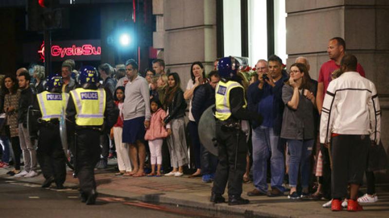 Guests from the Premier Inn Bankside Hotel are evacuated and kept in a group with police on Upper Thames Street following an incident in central London, Saturday. Terrorism struck at the heart of London, police said Sunday, after a vehicle veered off the road and mowed down pedestrians on London Bridge and gunshots rang out amid reports of knife attacks at nearby Borough Market. (Photo: AP) Guests from the Premier Inn Bankside Hotel are evacuated and kept in a group with police on Upper Thames Street following an incident in central London, Saturday. Terrorism struck at the heart of London, police said Sunday, after a vehicle veered off the road and mowed down pedestrians on London Bridge and gunshots rang out amid reports of knife attacks at nearby Borough Market. (Photo: AP)