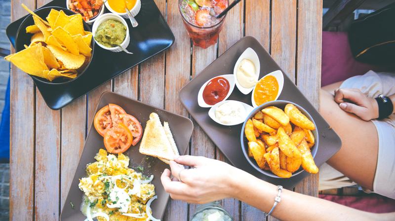 Eating out and mass consumption products have become cheaper as the lower GST rates on over 200 items come into effect from Wednesday. (Photo: Pexel) Eating out and mass consumption products have become cheaper as the lower GST rates on over 200 items come into effect from Wednesday. (Photo: Pexel)