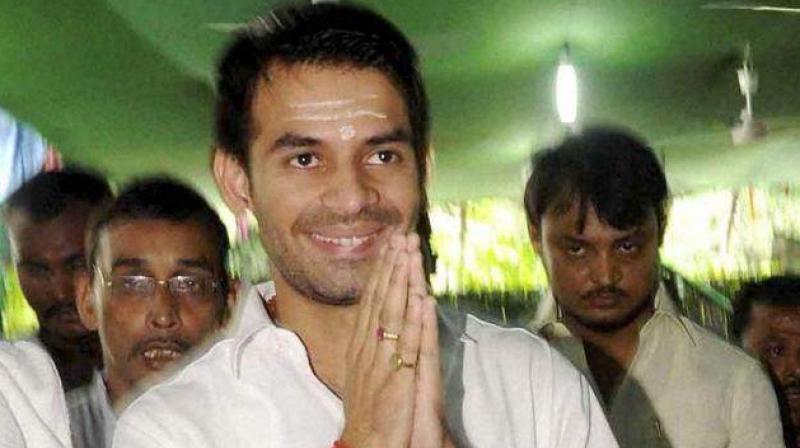 In a recent video footage Tej Pratap Yadav was purportedly shown threatening to disrupt Bihar Deputy CM Sushil Modi's son's marriage and using the words "ghar mein ghus kar maarenge (will beat inside his house)". (Photo: File | PTI) In a recent video footage Tej Pratap Yadav was purportedly shown threatening to disrupt Bihar Deputy CM Sushil Modi's son's marriage and using the words "ghar mein ghus kar maarenge (will beat inside his house)". (Photo: File | PTI)