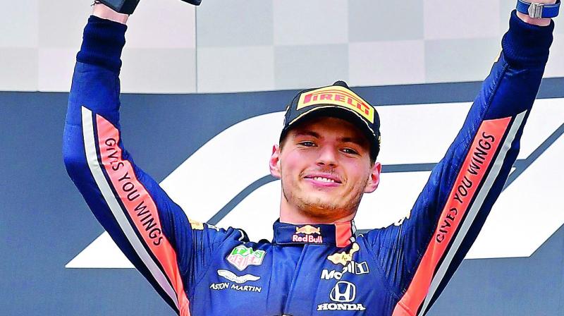 Dutch driver Max Verstappen of Red Bull celebrates with the trophy on the podium after winning the German Formula One Grand Prix at the Hockenheim racing circuit in Hockenheim, southern Germany, on Sunday. (Photo: AFP) Dutch driver Max Verstappen of Red Bull celebrates with the trophy on the podium after winning the German Formula One Grand Prix at the Hockenheim racing circuit in Hockenheim, southern Germany, on Sunday. (Photo: AFP)