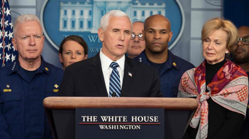 US Vice President Mike Pence, standing with members of the White House Coronavirus Task Force team, speaks during a press briefing in the press briefing room of the White House in Washington, DC. AFP Photo