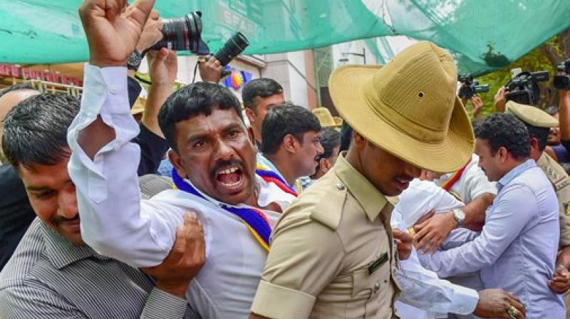 Pro-Kannada activists being detained by police personnel during their protest against Rajnikanth's 'Kaala' release, in Bengaluru on Thursday. Pro-Kannada outfits have threatened to stall release of 'Kaala' over Rajinikanth's reported remarks on the Cauvery row. (Photo: PTI) Pro-Kannada activists being detained by police personnel during their protest against Rajnikanth's 'Kaala' release, in Bengaluru on Thursday. Pro-Kannada outfits have threatened to stall release of 'Kaala' over Rajinikanth's reported remarks on the Cauvery row. (Photo: PTI)