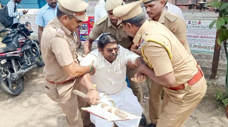 Activist Thirumurugan being taken away by policemen. (Photo: DC) Activist Thirumurugan being taken away by policemen. (Photo: DC)