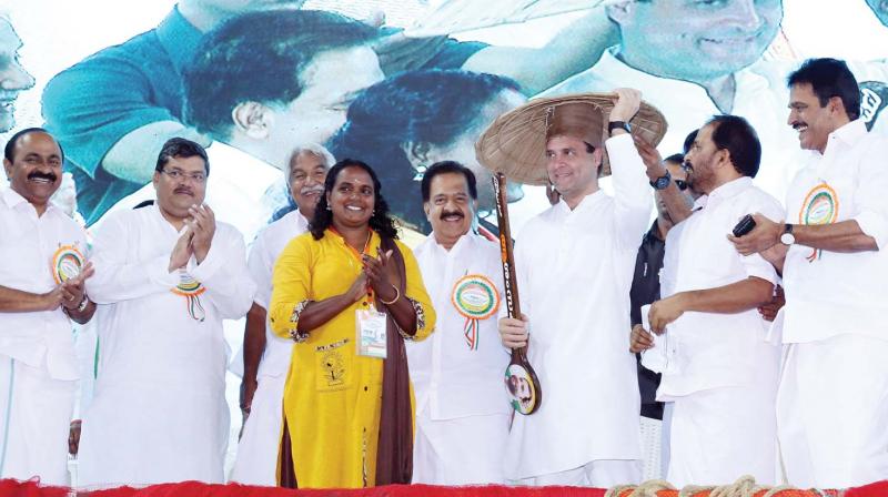 AICC president Rahul Gandhi before presenting an oar to Rekha Karthikeyan who became the first woman in the country to obtain deep-sea fishing licence at the at the National Fishermen's Parliament at Thripparayar on Thursday. V.D. Satheesan, MLA, AICC general secretaries Mukul Wasnik and Oommen Chandy, leader of opposition Ramesh Chennithala, National Fishermen Congress chairman and Thrissur DCC president T.N. Prathapan and AICC general secreatry K.C. Venugopal are also seen. (ANUP K. VENU) AICC president Rahul Gandhi before presenting an oar to Rekha Karthikeyan who became the first woman in the country to obtain deep-sea fishing licence at the at the National Fishermen's Parliament at Thripparayar on Thursday. V.D. Satheesan, MLA, AICC general secretaries Mukul Wasnik and Oommen Chandy, leader of opposition Ramesh Chennithala, National Fishermen Congress chairman and Thrissur DCC president T.N. Prathapan and AICC general secreatry K.C. Venugopal are also seen. (ANUP K. VENU)
