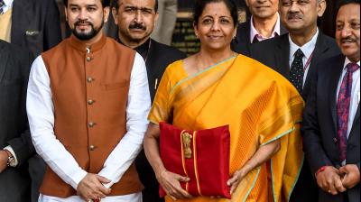 Finance minister Nirmala Sitharaman looks on as she leaves the Finance Ministry for Parliament to present the 2020-21 Union budget, in New Delhi on February 1, 2020. (AFP)
