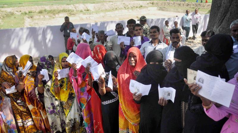 Voters stand in queues to cast their votes at a polling station in UP. (Photo: PTI/File) Voters stand in queues to cast their votes at a polling station in UP. (Photo: PTI/File)
