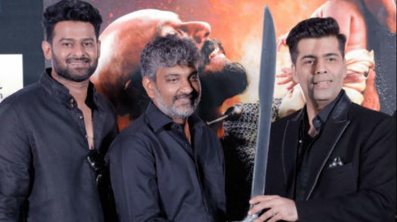 Prabhas, Rajamouli and Karan Johar at the trailer launch of 'Baahubali: The Conclusion.' Prabhas, Rajamouli and Karan Johar at the trailer launch of 'Baahubali: The Conclusion.'