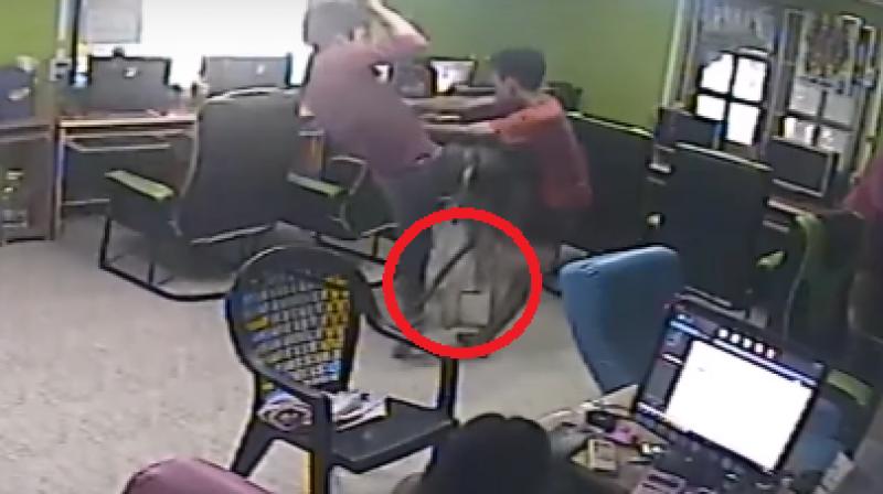 After the man kicked and jumped about, the snake slithered away but the scared friends stood on chairs to protect themselves. (Photo: Youtube) After the man kicked and jumped about, the snake slithered away but the scared friends stood on chairs to protect themselves. (Photo: Youtube)