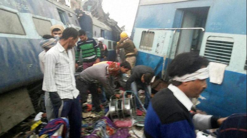 Rescue officials on the spot where 14 coaches of the Indore-Patna express derailed, killing more than 90 passengers. (Photo: PTI) Rescue officials on the spot where 14 coaches of the Indore-Patna express derailed, killing more than 90 passengers. (Photo: PTI)