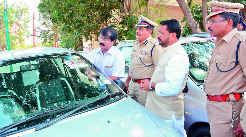 A cab registration sticker being affixed on a cab at the LB Nagar cab registration booth on Monday. (Photo: DC) A cab registration sticker being affixed on a cab at the LB Nagar cab registration booth on Monday. (Photo: DC)