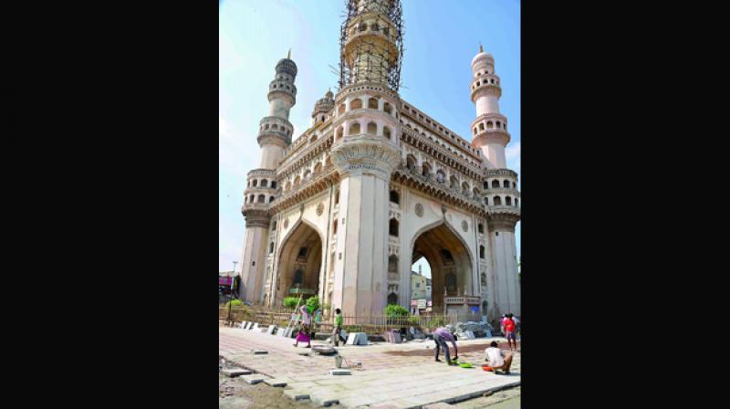 Tiles being laid around the Charminar at Hyderabad on Monday. (Photo: DC) Tiles being laid around the Charminar at Hyderabad on Monday. (Photo: DC)
