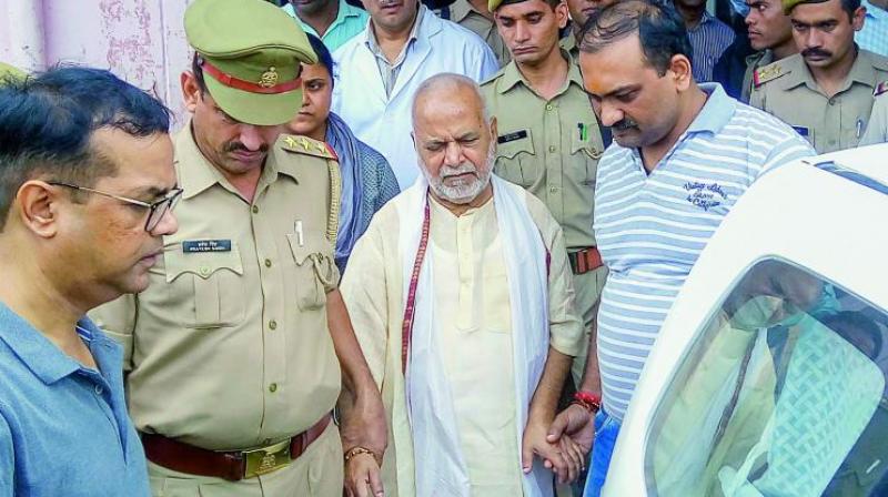 ources said the SIT also booked the woman on charges of causing disappearance of evidence. (Photo: PTI) ources said the SIT also booked the woman on charges of causing disappearance of evidence. (Photo: PTI)
