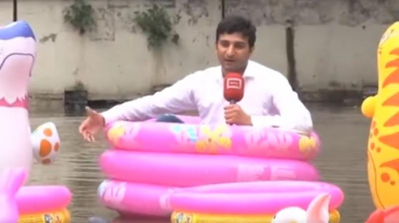 He further said he is "enjoying in water pool" and recommended the locals to do the same "as the water was not going to recede anytime soon." (Photo: Dunya News/ ANI) He further said he is "enjoying in water pool" and recommended the locals to do the same "as the water was not going to recede anytime soon." (Photo: Dunya News/ ANI)