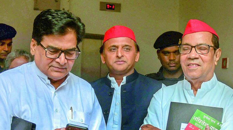 Samajwadi Party president Akhilesh Yadav flanked by party’s general secretary Ram Gopal Yadav (left) and party vice-president Kiranmoy Nanda at the National Executive meeting at Lucknow on Saturday. Samajwadi Party president Akhilesh Yadav flanked by party’s general secretary Ram Gopal Yadav (left) and party vice-president Kiranmoy Nanda at the National Executive meeting at Lucknow on Saturday.
