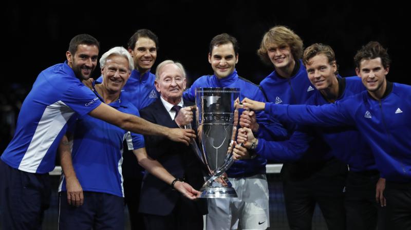 Team Europe together with tennis legend Australian Rod Laver hold a trophy after defeating team World in the Laver Cup tennis tournament in Prague. (Photo:AP) Team Europe together with tennis legend Australian Rod Laver hold a trophy after defeating team World in the Laver Cup tennis tournament in Prague. (Photo:AP)