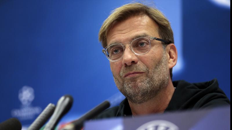 Liverpool trail leaders Sevilla by two points, but with four games still to come, Klopp is relaxed about his team's situation. (Photo:AP) Liverpool trail leaders Sevilla by two points, but with four games still to come, Klopp is relaxed about his team's situation. (Photo:AP)