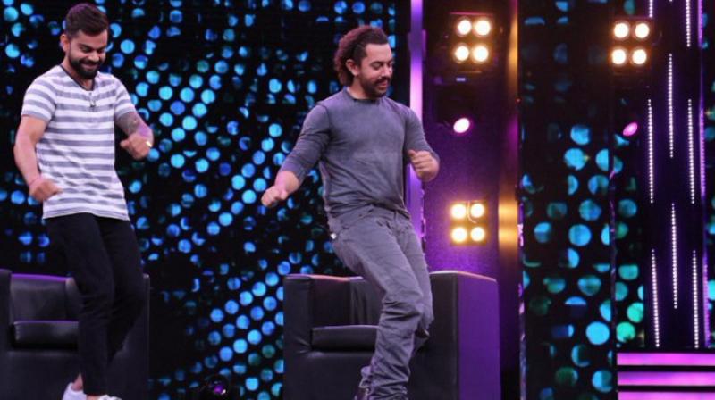 Virat Kohli and Amir Khan shook a leg on popular song Rang De Basanti and Dhinka Chika. (Photo: Twitter) Virat Kohli and Amir Khan shook a leg on popular song Rang De Basanti and Dhinka Chika. (Photo: Twitter)