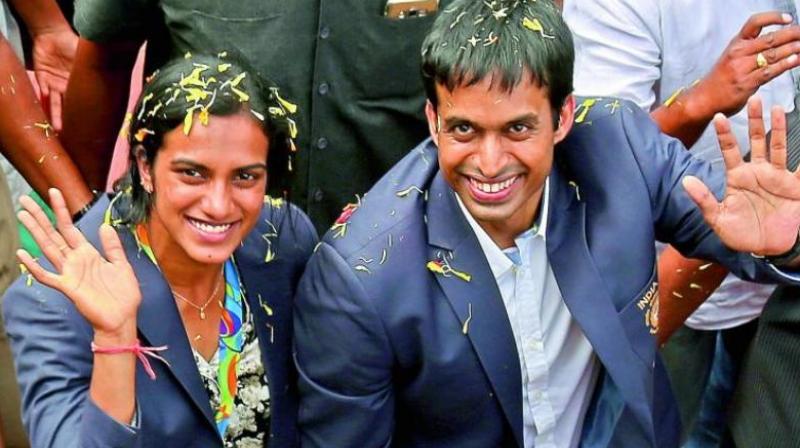 Gopichand (right) said that there is immense potential but a lot needs to be done in the system. (Photo:AP) Gopichand (right) said that there is immense potential but a lot needs to be done in the system. (Photo:AP)