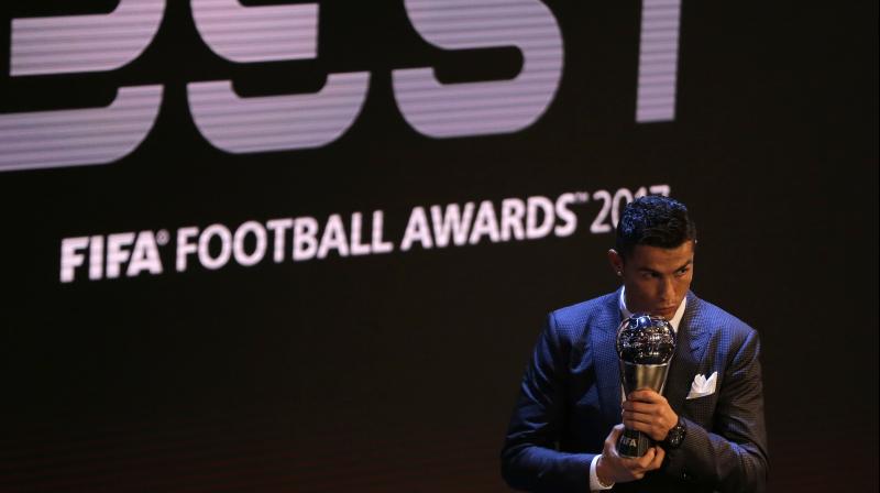 Christiano Ronaldo holds the Best FIFA Men's player award during The Best FIFA 2017 Awards at the Palladium Theatre in London. (Photo:AP) Christiano Ronaldo holds the Best FIFA Men's player award during The Best FIFA 2017 Awards at the Palladium Theatre in London. (Photo:AP)