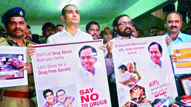 Enforcement director Akun Sabharwal and Excise and prohibition commissioner R.V. Chandravadan release posters to discourage drug consumption in Hyderabad on Monday. (Photo: DC) Enforcement director Akun Sabharwal and Excise and prohibition commissioner R.V. Chandravadan release posters to discourage drug consumption in Hyderabad on Monday. (Photo: DC)