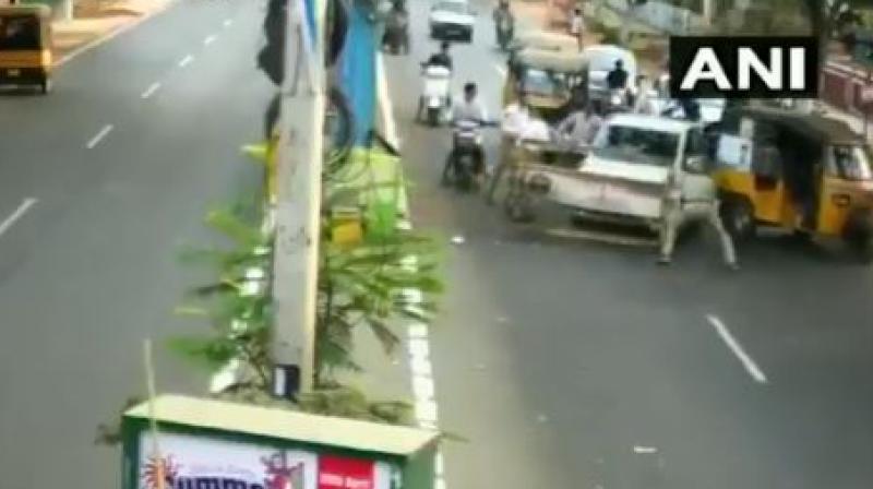 The visuals were caught on a CCTV camera which shows the accused muscling his way through the policemen standing in front of his car. (Photo: Screengrab) The visuals were caught on a CCTV camera which shows the accused muscling his way through the policemen standing in front of his car. (Photo: Screengrab)