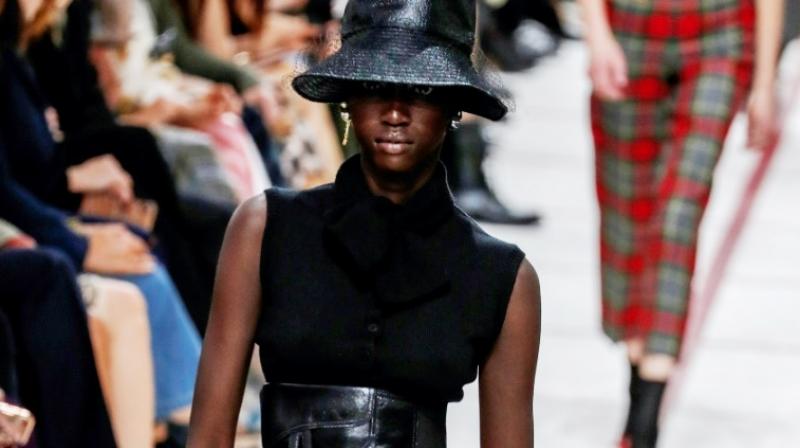 A model wearing a bucket hat and leather cumberband at the Dior's tartan-heavy Paris autumn winter show. (Photo: AFP) A model wearing a bucket hat and leather cumberband at the Dior's tartan-heavy Paris autumn winter show. (Photo: AFP)