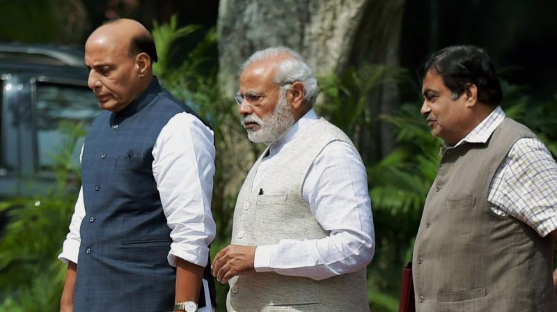 Prime Minister Narendra Modi along with Home Minister Rajnath Singh and Transport Minister Nitin Gadkari. (Photo: PTI/File) Prime Minister Narendra Modi along with Home Minister Rajnath Singh and Transport Minister Nitin Gadkari. (Photo: PTI/File)