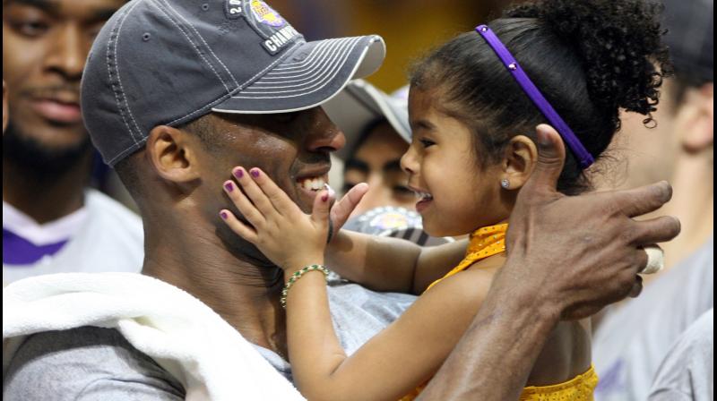 Los Angles Lakers guard Kobe Bryant with his daughter Gianna. AP Photo