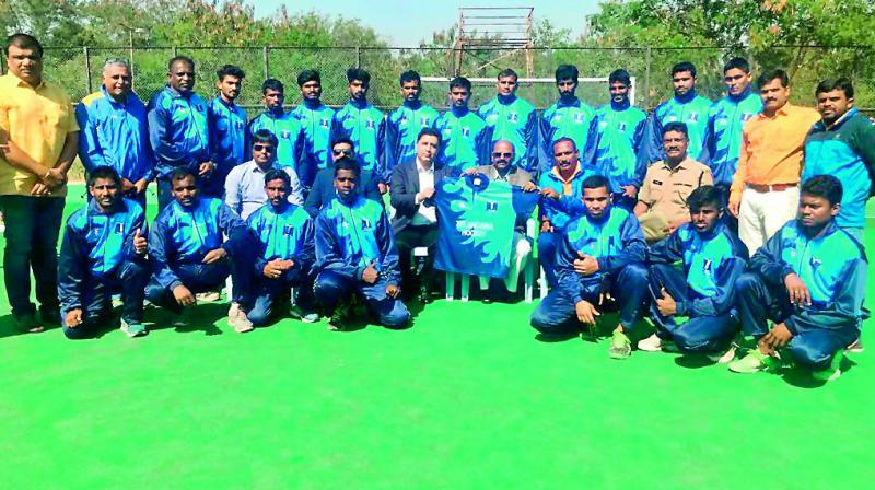 Members of the Telangana hockey team pose in Hyderabad after receiving their kits for the upcoming National Championships to be held in Chennai from Friday. Members of the Telangana hockey team pose in Hyderabad after receiving their kits for the upcoming National Championships to be held in Chennai from Friday.