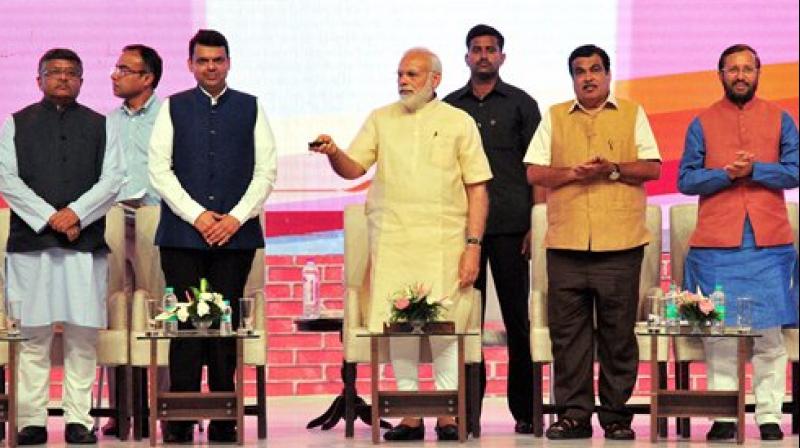 Prime Minister Narendra Modi inaugurates BHIM Aadhar schemes in Nagpur, Maharashtra on Friday. Union Ministers Nitin Gadkari, Ravi Shankar Prasad, Prakash Javadekar and Maharashtra Chief Minister Devendra Fadnavis are also seen.(Photo:PTI) Prime Minister Narendra Modi inaugurates BHIM Aadhar schemes in Nagpur, Maharashtra on Friday. Union Ministers Nitin Gadkari, Ravi Shankar Prasad, Prakash Javadekar and Maharashtra Chief Minister Devendra Fadnavis are also seen.(Photo:PTI)