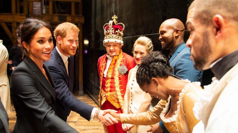 Britain's Prince Harry, Duke of Sussex, (2L) and Britain's Meghan, Duchess of Sussex (L) meet members of the cast and crew backstage after a gala performance of the musical 'Hamilton' in support of the charity Sentebale at the Victoria Palace Theatre in London on August 29, 2018. (Photo: AFP) Britain's Prince Harry, Duke of Sussex, (2L) and Britain's Meghan, Duchess of Sussex (L) meet members of the cast and crew backstage after a gala performance of the musical 'Hamilton' in support of the charity Sentebale at the Victoria Palace Theatre in London on August 29, 2018. (Photo: AFP)