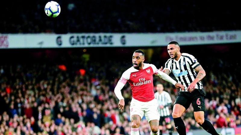Arsenal’s Alexandre Lacazette (left) vies for the ball during the match against Newcastle United in the English Premier League at the Emirates Stadium in London on Monday. Arsenal won 2-0. (Photo: AP) Arsenal’s Alexandre Lacazette (left) vies for the ball during the match against Newcastle United in the English Premier League at the Emirates Stadium in London on Monday. Arsenal won 2-0. (Photo: AP)