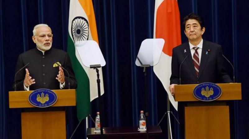 Prime Minister Narendra Modi as his Japanese counterpart Shinzo Abe speaks during their joint statement in Tokyo. (Photo: PTI) Prime Minister Narendra Modi as his Japanese counterpart Shinzo Abe speaks during their joint statement in Tokyo. (Photo: PTI)