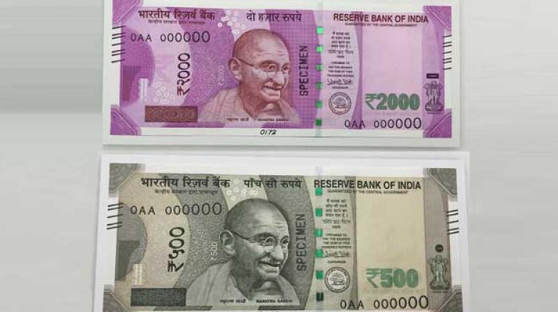Specimen notes of new Rs.500 and 2000 notes. (Photo: PTI) Specimen notes of new Rs.500 and 2000 notes. (Photo: PTI)