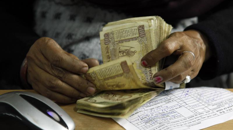 A cashier counts Rs 500 notes at a bank in Allahabad. (Photo: AP) A cashier counts Rs 500 notes at a bank in Allahabad. (Photo: AP)