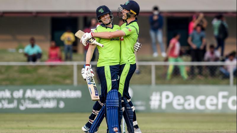 Irelands Kevin OBrien (L) and teammate Harry Tector celebrate after winning the third T20 against Afghanistan in Greater Noida on Tuesday. AFP Photo