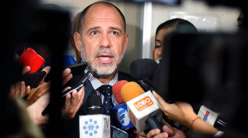 Paraguayan judge Gustavo Amarilla speaks with the press after ratifying Brazilian retired football player Ronaldinho and his brother Roberto Assis pretrial detention, for allegedly entering Paraguay with a fake passport, at the Justice Palace in Asuncion on Tuesday. 10, 2020. AFP Photo