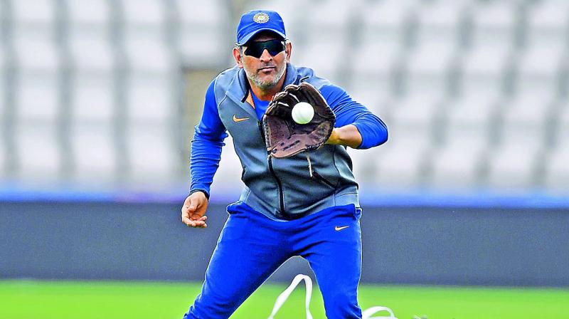 M.S. Dhoni during a training session on Monday. — AP M.S. Dhoni during a training session on Monday. — AP